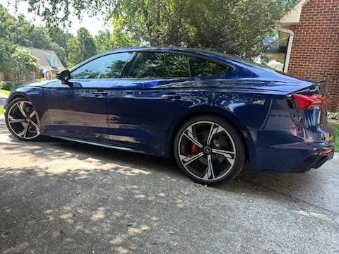 Blue sedan detailed to a mirror finish during mobile auto detailing in Lewisville, NC