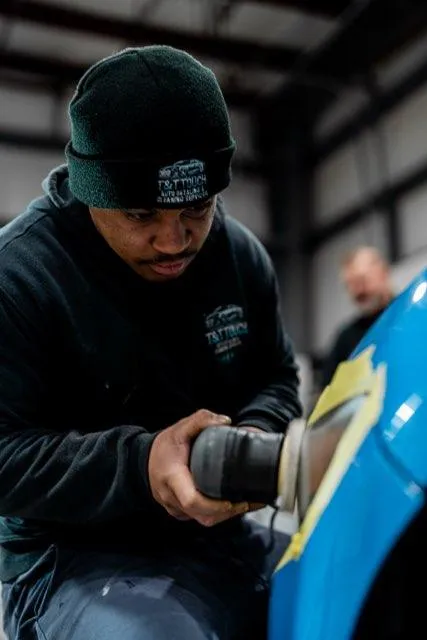 Paint correction on a blue fender to remove swirls and light defects in Lewisville, NC