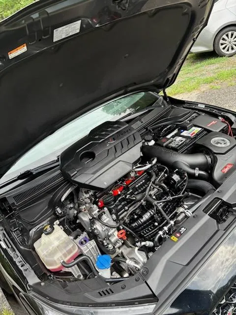 Deep engine bay cleaning on an SUV during a mobile auto detailing appointment in Lewisville, NC