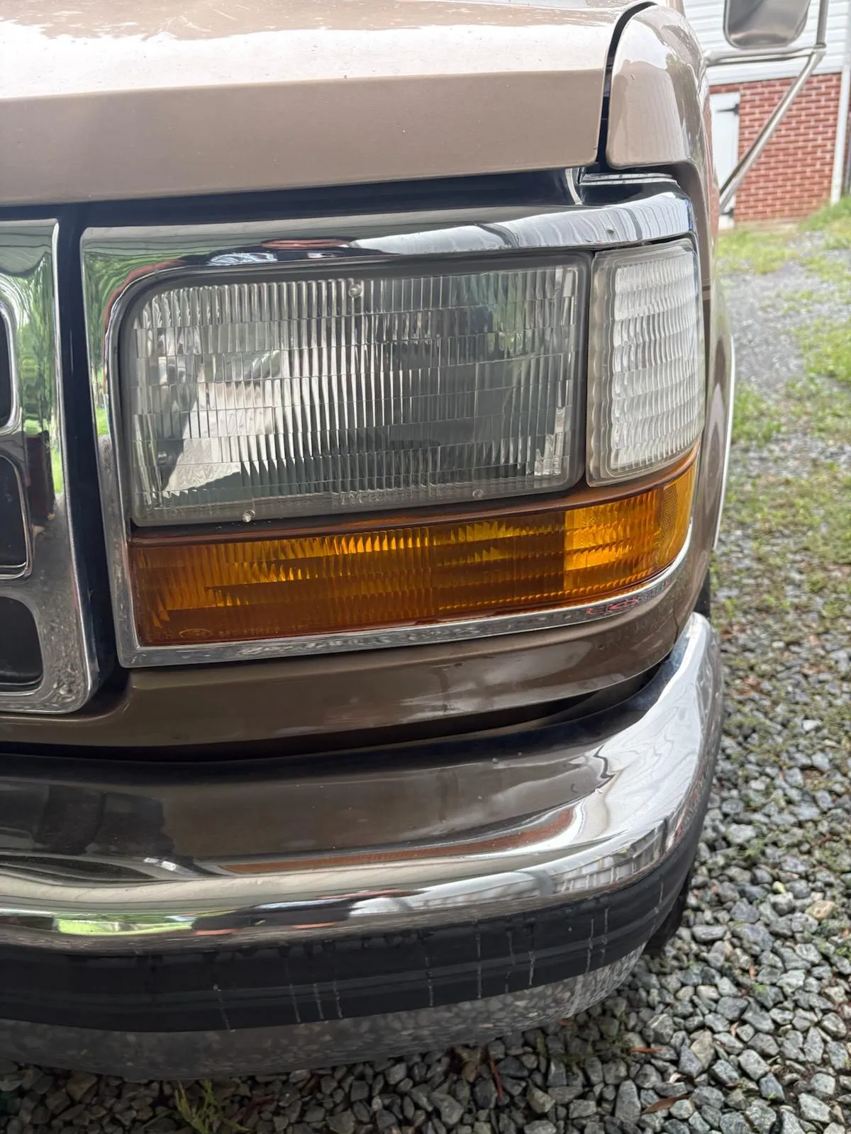 Before-and-after view of an oxidized headlight restored in Lewisville, NC