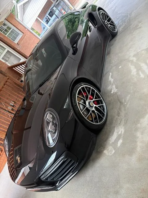 Freshly detailed black sedan showing deep gloss after exterior detailing in Lewisville, NC