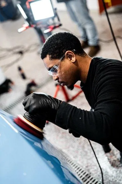 Paint polishing on a blue hood during a two-step paint correction in Lewisville, NC