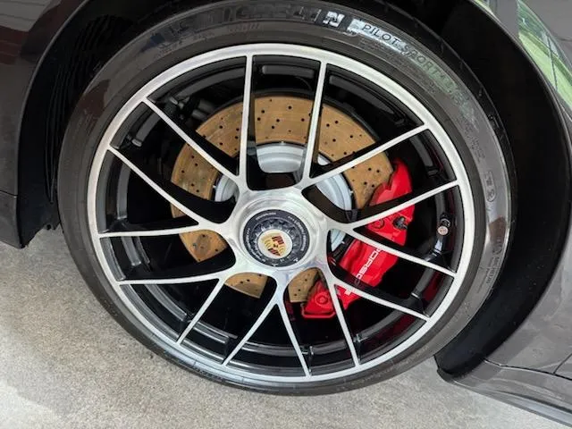 Wheel detailing on a sports car during mobile auto detailing in Lewisville, NC